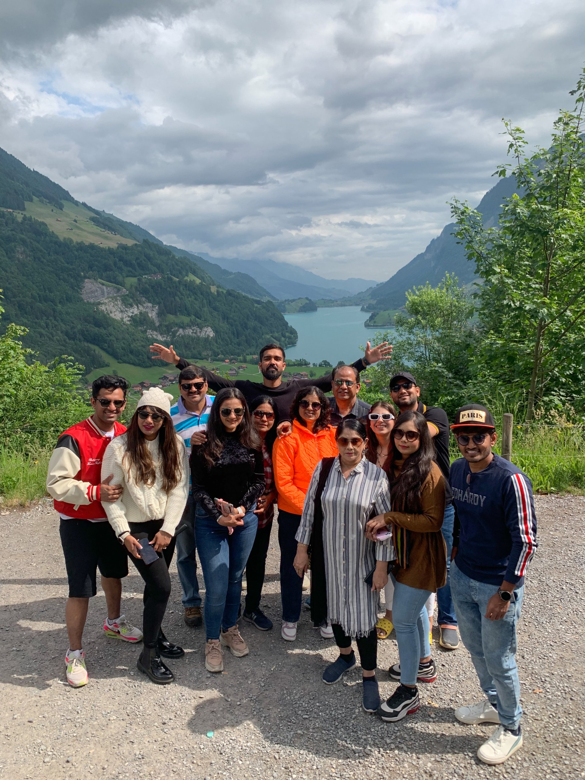 A Saifarnama group on tour above a lake in Switzerland
